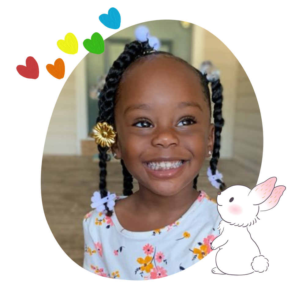 little black girl with natural ponytails with hairbows and hair clips